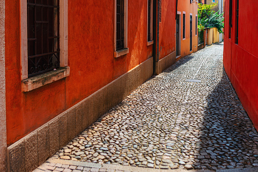Narrow cobblestone street wind through the historic district of the old town