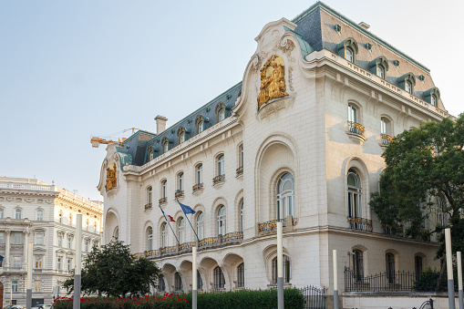 Vienna, Austria - June 18, 2013: The Belvedere Palace. It is a historic building complex consisting of two Baroque palaces (the Upper and Lower Belvedere) - the image shows the upper Belvedere seen from the garden. Tourists are walking around.