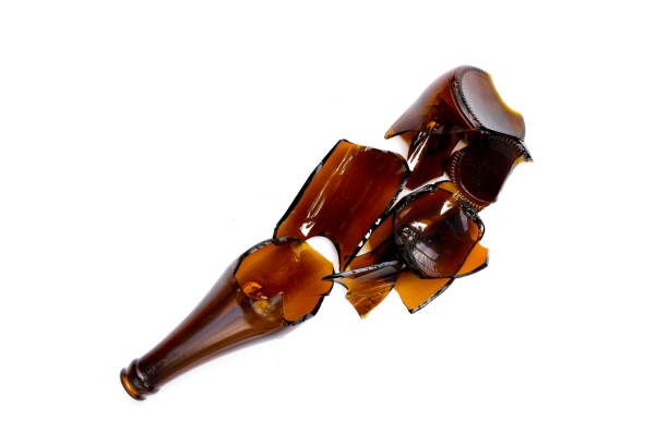 istock Broken brown bottle, glass shards on white background 1956105078