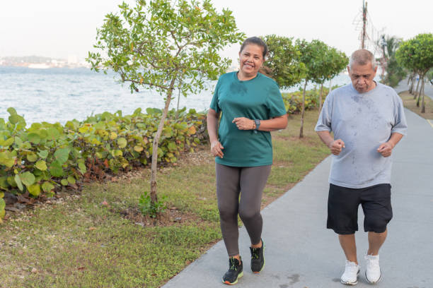 istock Senior Couple Enjoying Seaside Jog 1956122939