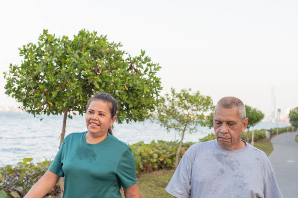 istock Senior Couple Enjoying Seaside Walk 1956123454