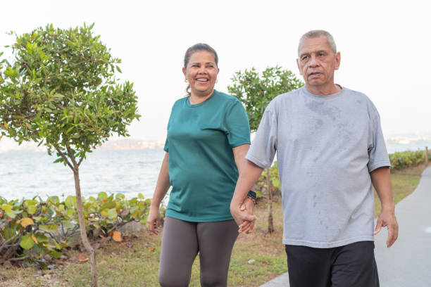 istock Senior Couple Enjoying Seaside Walk 1956123961