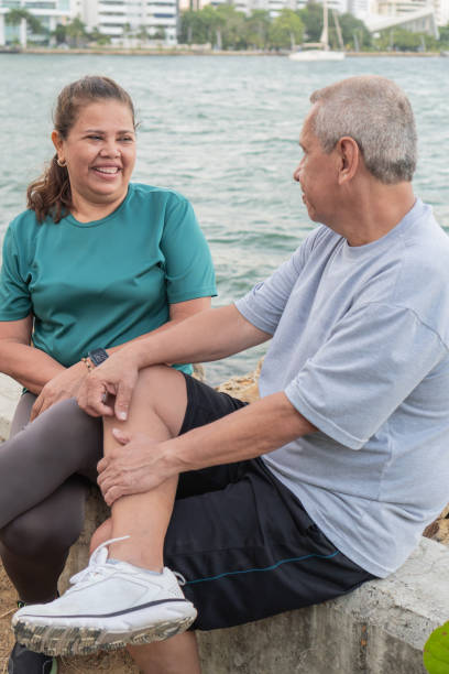 istock Engaged Senior Couple Conversing by the Riverside 1956130201