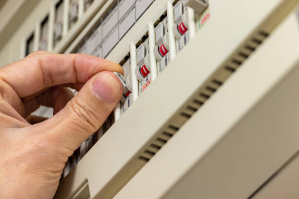 istock Operate the breaker switch on the distribution board with fingers 1956191671