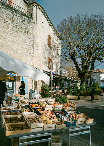 December 23, 2023, Montcuq, France: Local produce at the weekend market. Street markets in Montcuq are held every weekend. Local people and tourists come along to buy local produce on the bustling stalls.Montcuq  is a town and former commune in the Lot department in south-western France near Cahors.