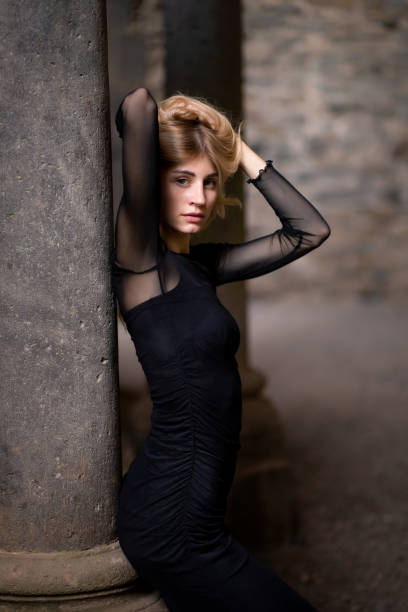Portrait of a young woman in elegant dress.