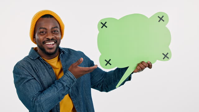 Black man, speech bubble and quote presentation, social media or creative chat and reviews on a white background. Face of young person with poster, communication mockup and tracking marker in studio
