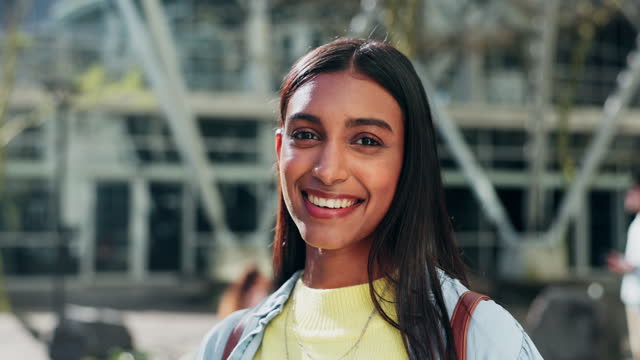 Face, woman and student smile at college for education, learning and knowledge at campus building. Portrait of young gen z indian girl studying at academy, university and pride for scholarship degree