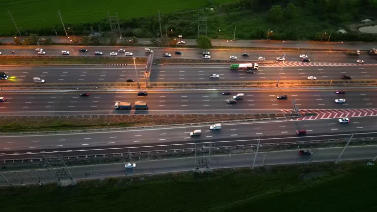 A busy Night city road in winter view from above. Aerial View of Highway Interchange