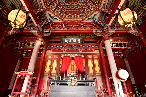 Taipei, Taiwan - Jan 17, 2024: The hall where Confucius is worshipped in Taipei Confucius Temple. The words on the plaque are Confucius' famous saying: There is no distinction between teachings.