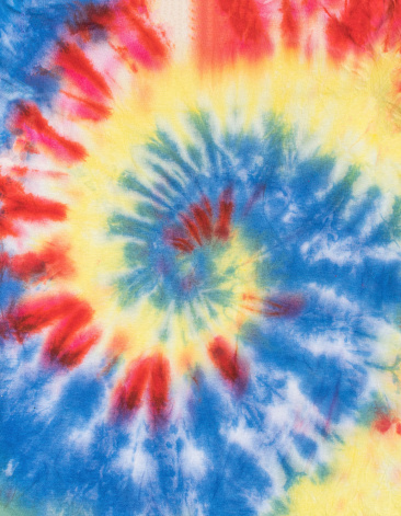 The fabric is painted in a classic tie dye pattern. Manual dyeing of fabric.
