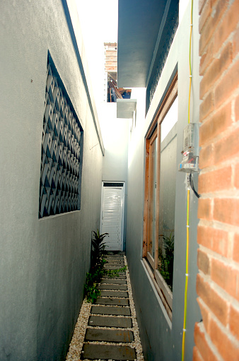 Small house with narrow alley in Indonesia.