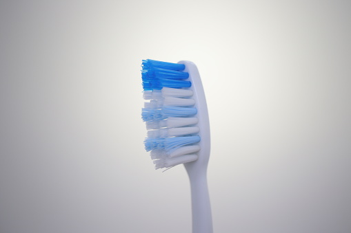 Closeup point of view asian woman feels tooth ache and uncomfortable when brushing her teeth at bathroom