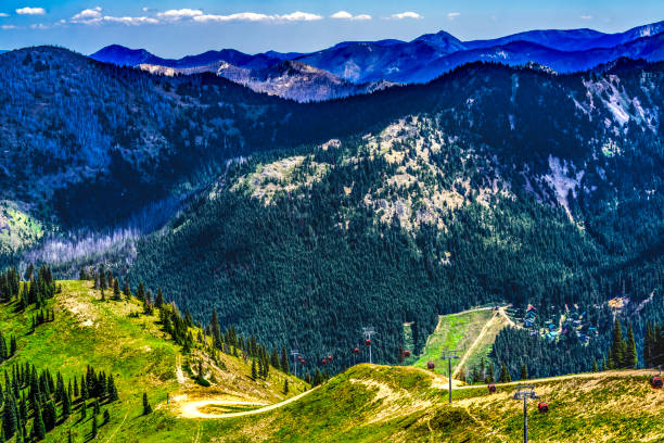 Red Gondolas Ski lift Green Mountains Crystal Mountain Alpine Ski Area Pierce County Washington. Crystal Mountain Largest Washington Ski Resort next to Mount Rainier.