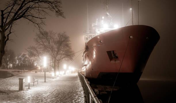 dawn through the fog in the port city of Oslo