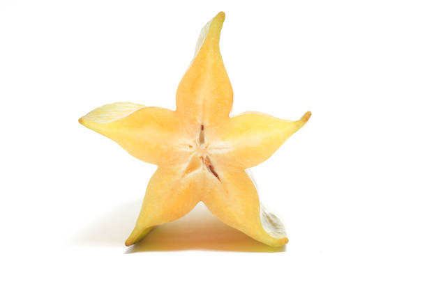istock Half cut fresh organic star fruit delicious front view isolated on white background clipping path 1956516483