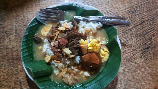 Nasi gandul, traditional food from Pati, Central Java, Indonesia. Served with meat slices and eggs.