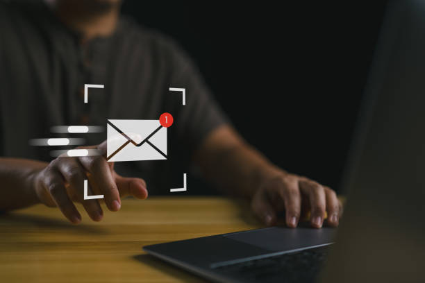 istock Online working internet network. Businessman sending email by laptop computer to customer, business contact and communication, email icon, email marketing concept, send e-mail or newsletter. 1956537424