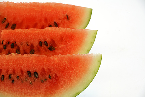 sliced fresh seed watermelon isolated on white background