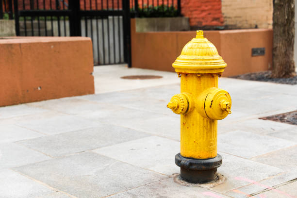 istock urban scene with a red fire hydrant standing tall on a sunlit street corner, symbolizing safety and preparedness 1956558584