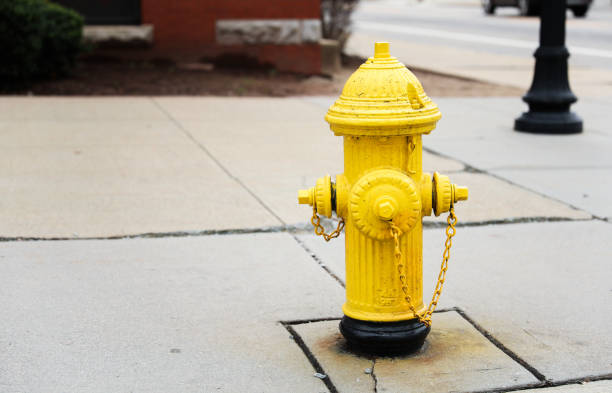 istock urban scene with a red fire hydrant standing tall on a sunlit street corner, symbolizing safety and preparedness 1956562049