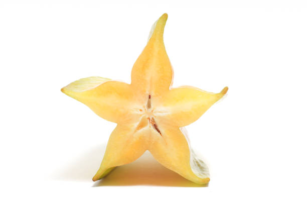 istock Half cut fresh organic star fruit delicious front view isolated on white background clipping path 1956624558