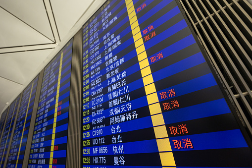 Hong Kong - September 1, 2023 : A departure screen displays cancelled flights at Hong Kong International Airport as Super Typhoon Saola approaching Hong Kong.