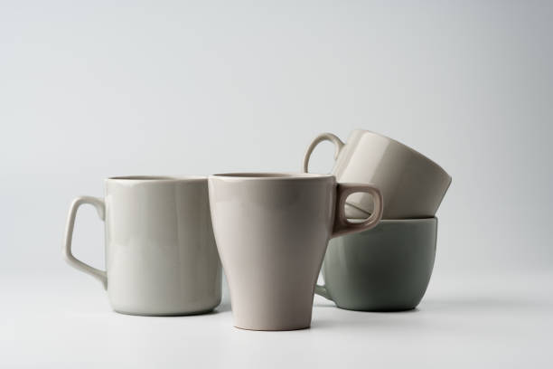 istock Gray coffee mugs mock up on white background 1956675477