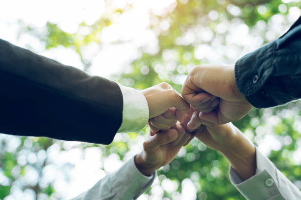istock Group of volunteer people joining for cooperation about global community teamwork with join hand together, World environment day, sustainable development goal. 1956680152