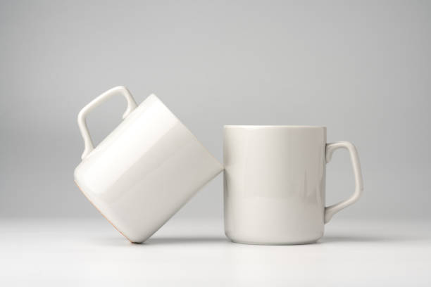 istock Blank white mugs mock up on white background 1956691838