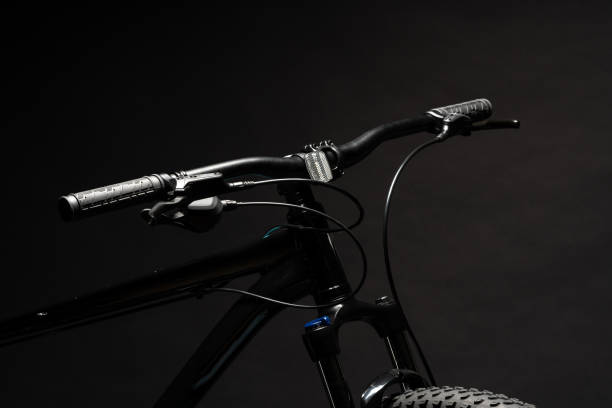 istock Close up of a bicycle against black background 1956702675