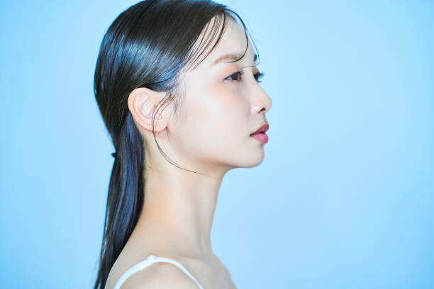 istock Young woman and light blue background 1956714039