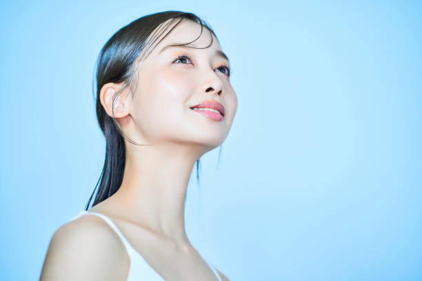 istock Young woman and light blue background 1956717692