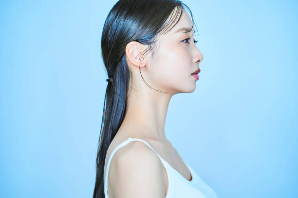 istock Young woman and light blue background 1956718221