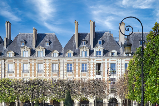 Paris, the place des Vosges in the Marais, beautiful buildings with a public park