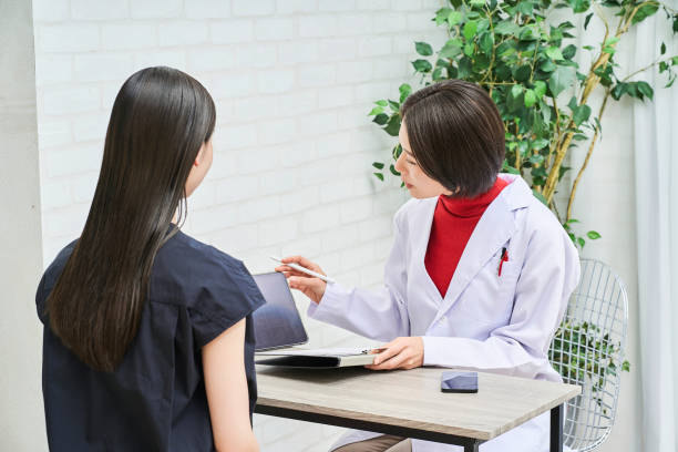 istock Doctor talking with female patient 1956753602