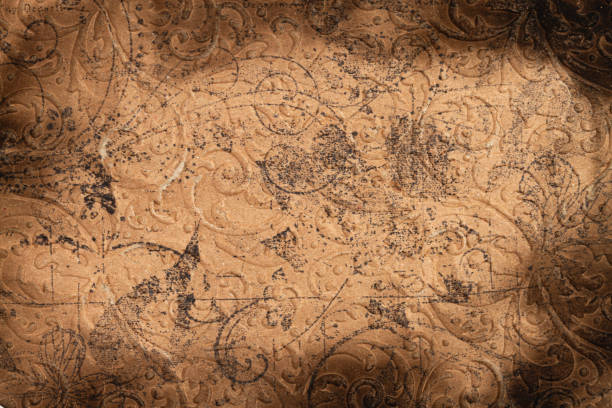 Close-up vintage craft burnt paper texture with floral ornament