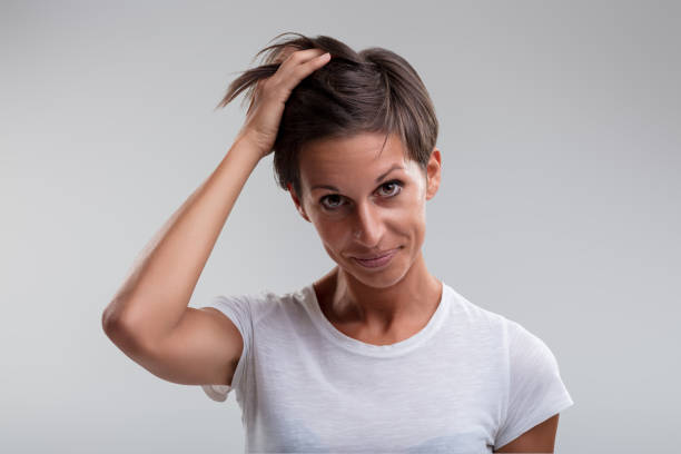 istock Mild bashfulness, underlying resolve, woman stands prepared 1956768590