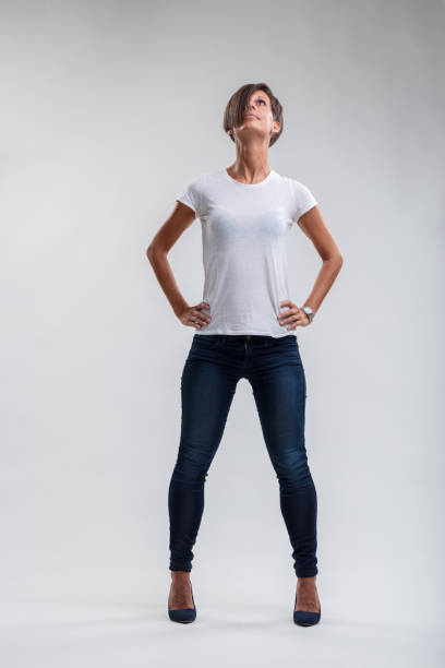 istock Strength personified in upward-looking woman's assertive stance 1956770672