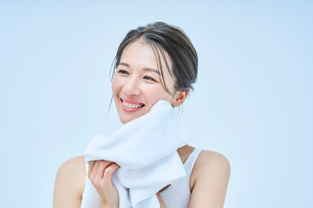 istock asian woman wiping her face 1956778511