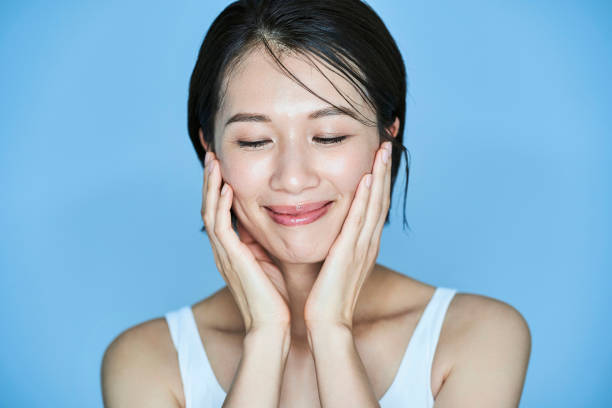 istock A woman checking her skin condition 1956781102
