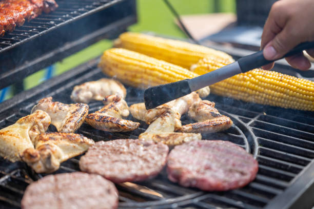 istock Cooking meat and corn on grill 1956782659