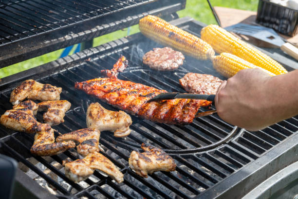 istock Meat and vegetables being roasted on grill 1956782669