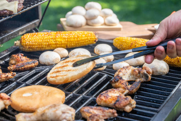 istock Burger buns, meat and vegetables on grill 1956782673