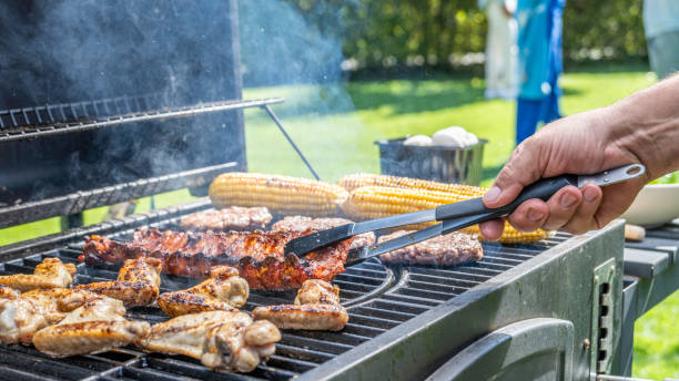 istock Meat and vegetables being roasted on grill 1956782680
