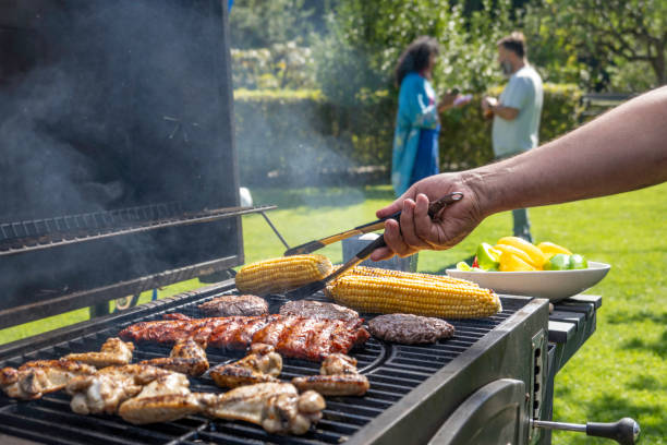 istock Meat and vegetables being roasted on grill 1956782686