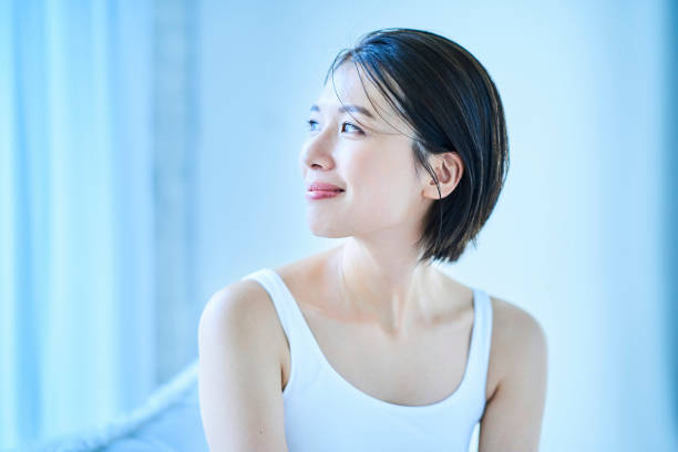 istock A woman relaxing by a window 1956784781