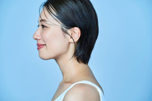 istock a woman standing in front of a plain background 1956787934