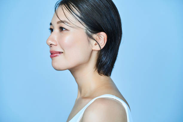 istock a woman standing in front of a plain background 1956788965