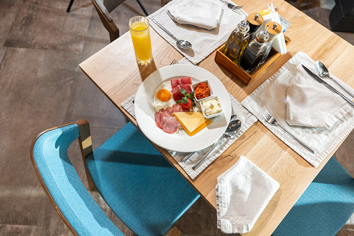 Table for one set for breakfast in luxury hotel restaurant
